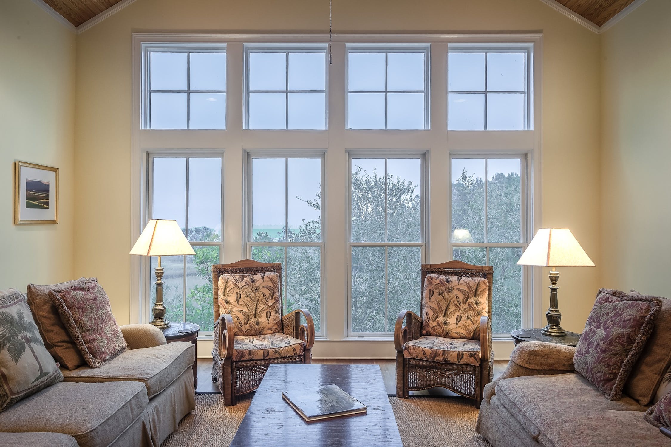 Sunlit living room with custom-manufactured replacement windows